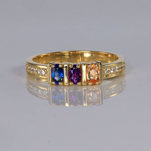 oval three stone yellow gold birthstone ring